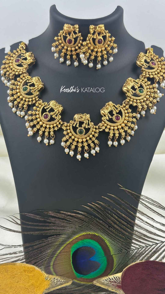 KN1209 - Pooram Aana Maala